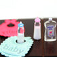 Dolls House Miniature Baby Bottles Shampoo Bibs Set Nursery Accessory Gift